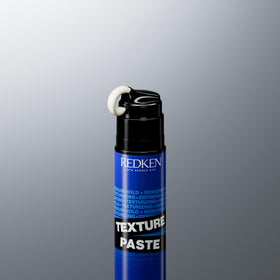 Redken product beside ruler for size reference and travel-friendly benefit