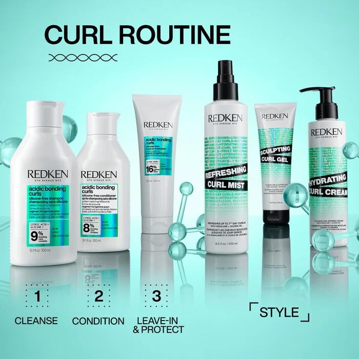 Redken bottle next to hand for scale showing travel-friendly size and design