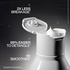 Redken creamy thick conditioner texture close-up for efficient coverage