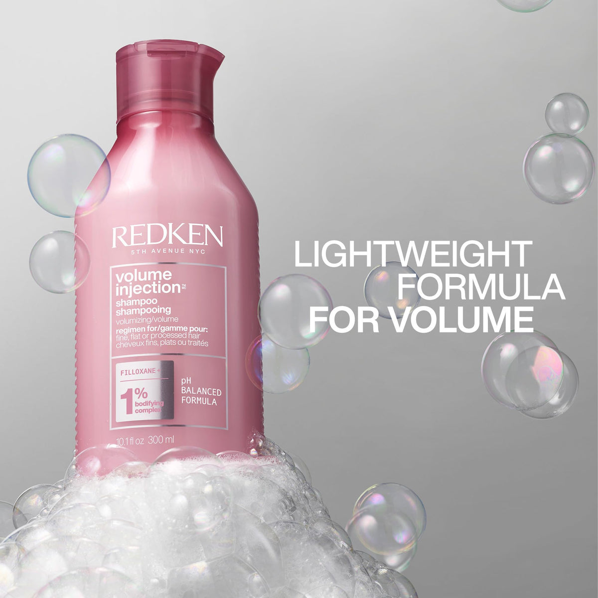 Redken finished hair after blow-dry showing visible root lift and shine