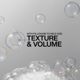 Redken shampoo lather texture close-up showing lightweight foam and gentle cleanse benefit