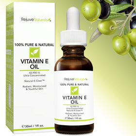 Applying RejuveNaturals Vitamin E oil as a facial spot treatment to improve texture