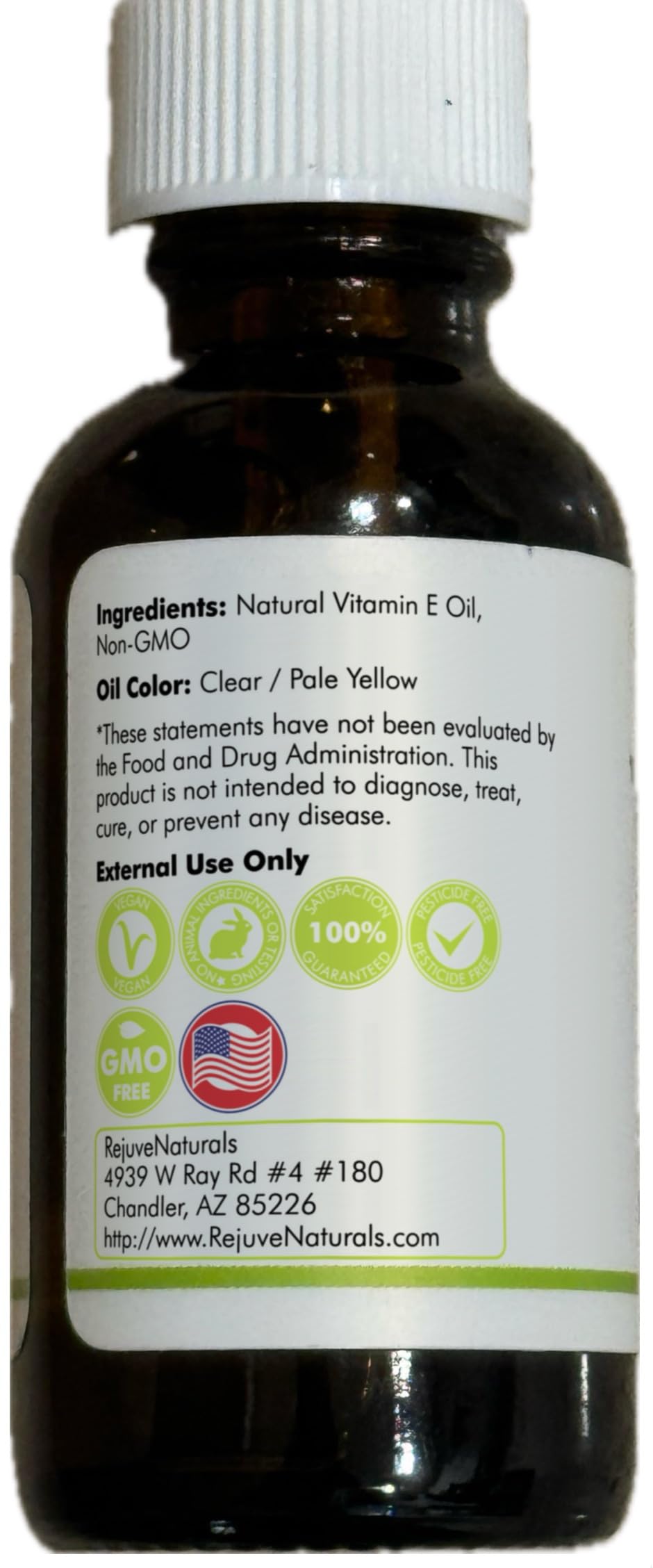 Olives and RejuveNaturals oil bottle to show plant-based d-alpha tocopherol source