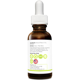 RejuveNaturals Vitamin E oil displayed in a bathroom setting to suggest daily use