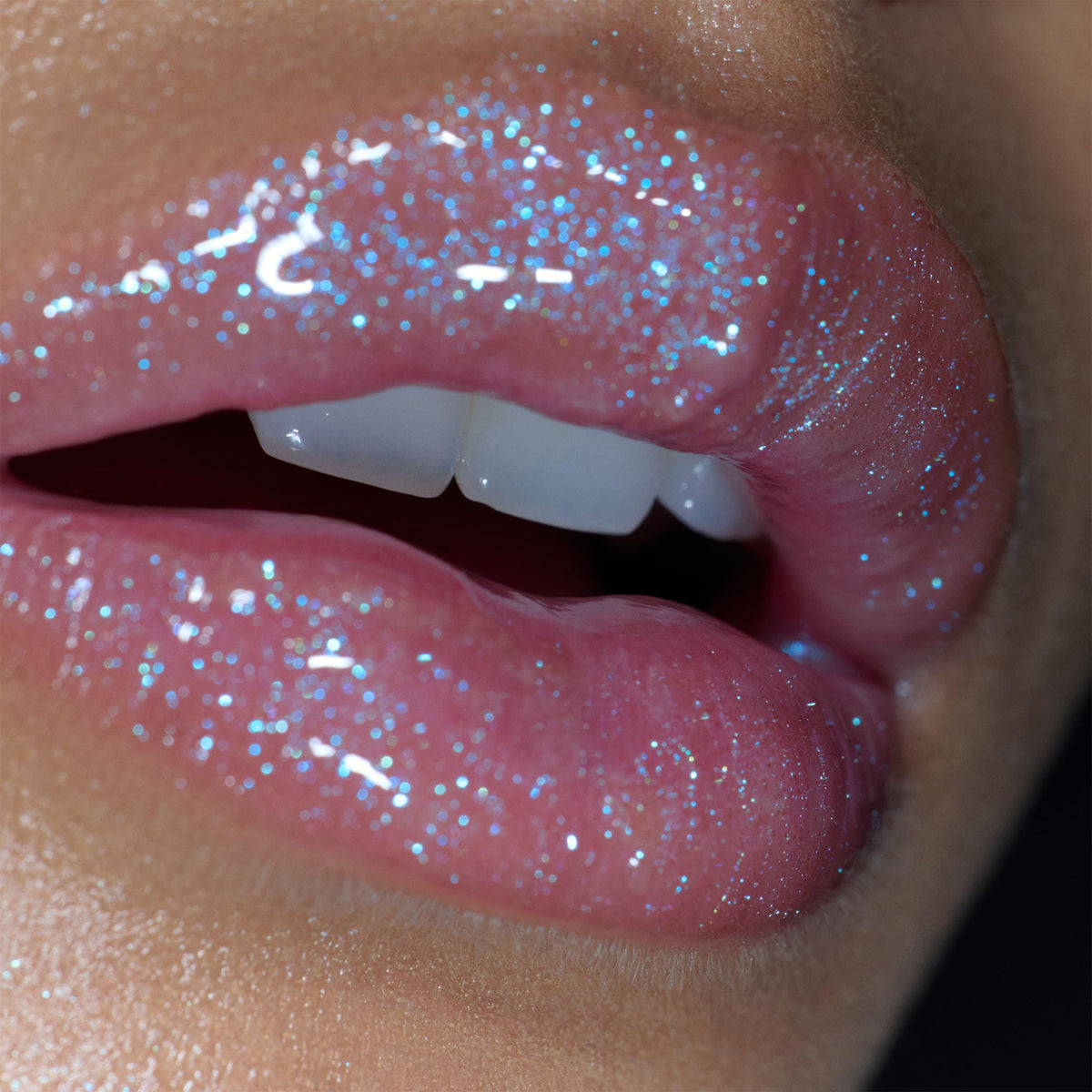 r.e.m. beauty on lips in studio lighting highlighting plump shine