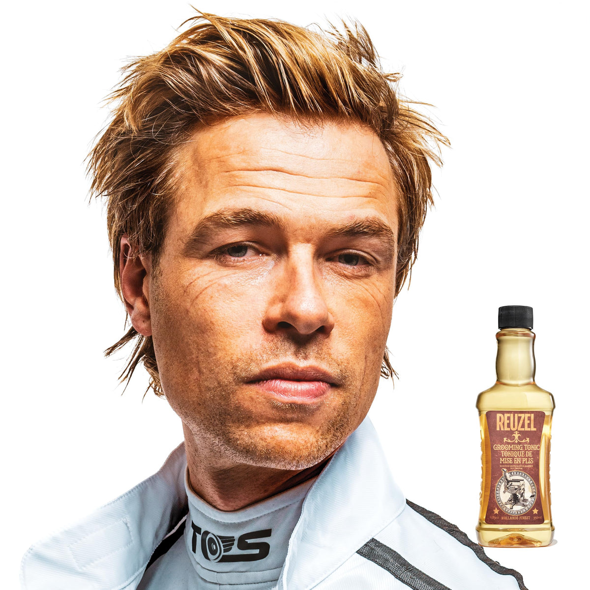 REUZEL tonic being applied to damp hair for heat protection and improved styling