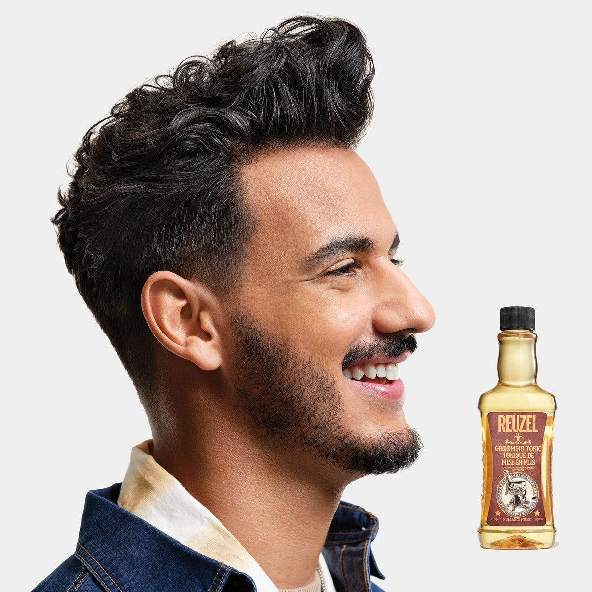 REUZEL tonic pouring to show lightweight water-soluble texture and easy application