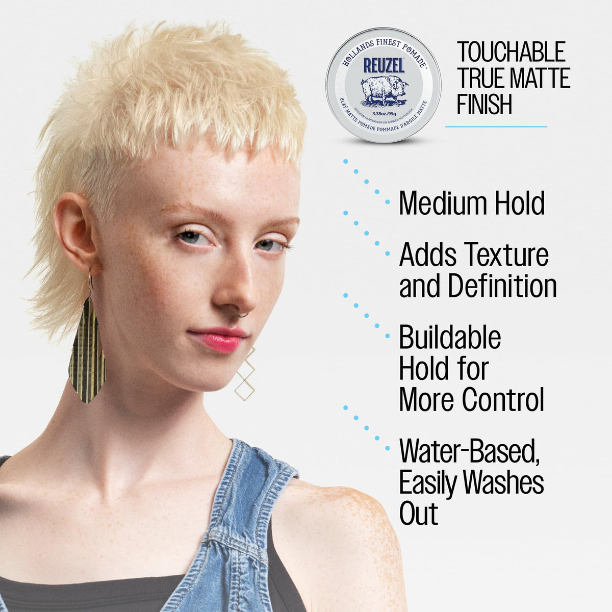 REUZEL pomade beside comb and towel indicating travel-friendly size