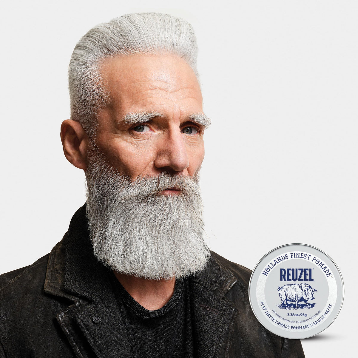 REUZEL pomade rinsing under water showing effortless washout