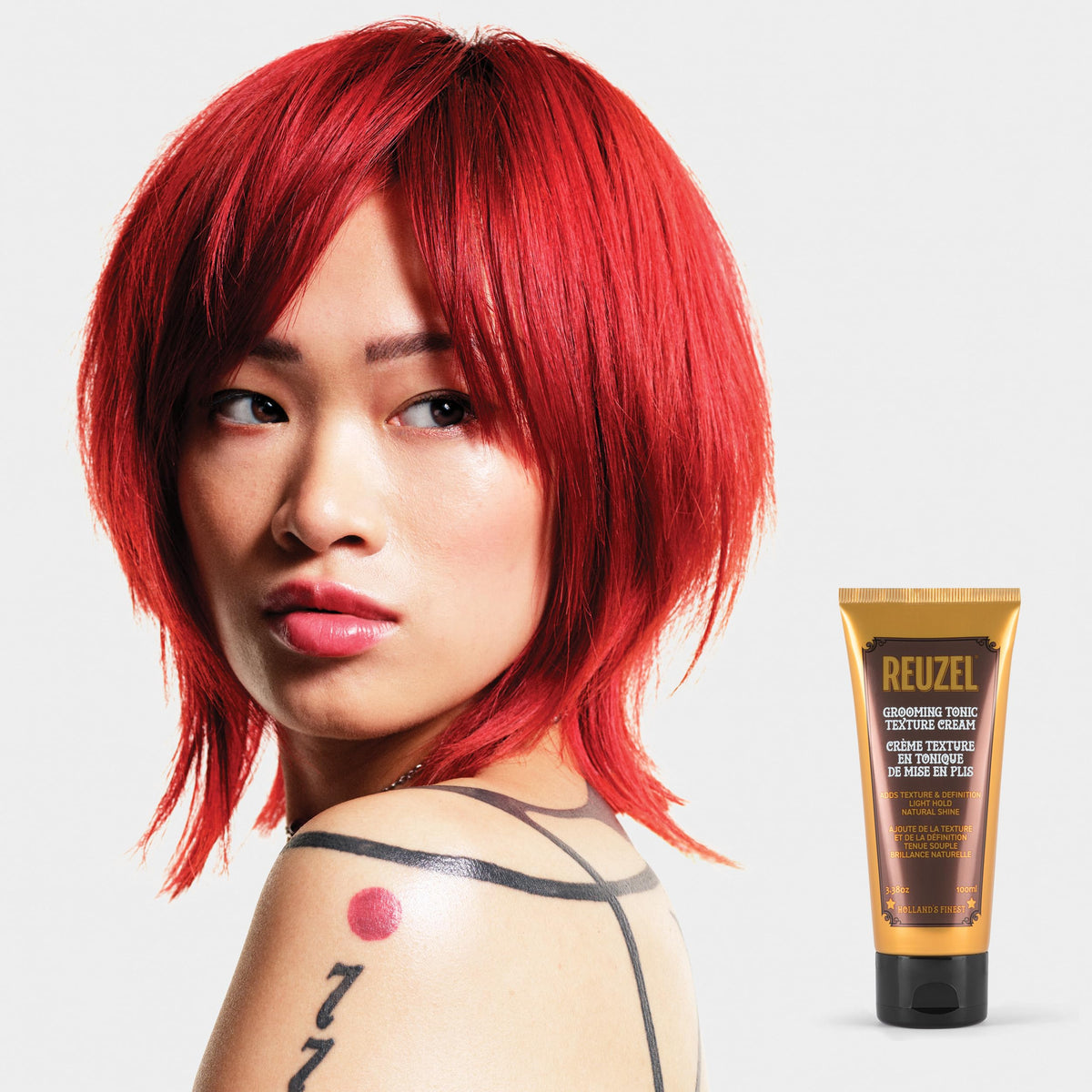 REUZEL used with blow-dryer to boost volume and shape hair