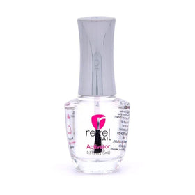 Revel Nail liquids being applied to nails on a model hand demonstrating smooth, controlled application