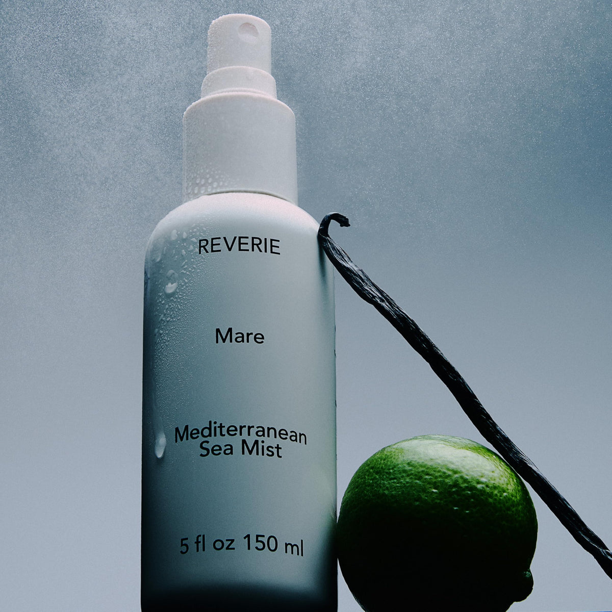 REVERIE spraying on hair to create beachy waves and added volume