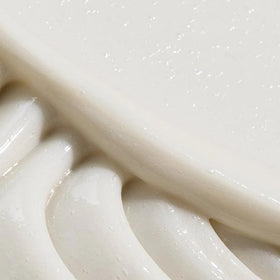 REVERIE pump and label detail emphasizing easy dispensing and clarity