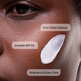 Revision Skincare tube in hand for size reference and portability benefit