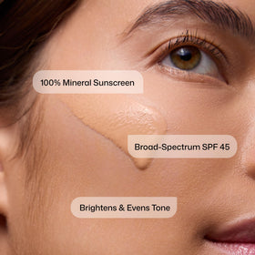 Revision Skincare tinted swatch on arm showing natural color correction