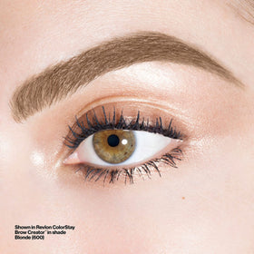 Revlon Brow Creator next to a coin for scale, compact travel-friendly brow tool