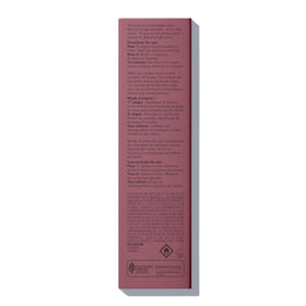REVLON compact tube in hand showing travel-friendly size and pocket portability benefit