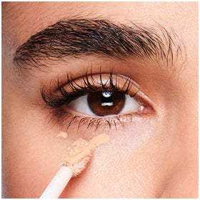 Revlon ColorStay concealer being applied under eye showing brightening effect