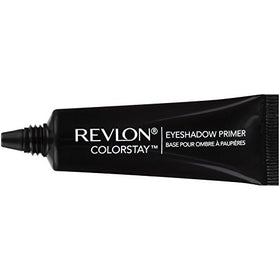 Revlon primer beside ruler and shadow palette showing compact 0.33 oz size for travel