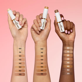 Revlon glimmer stick travel-ready flatlay with compact essentials for on-the-go glow