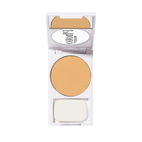 Model applying Revlon PhotoReady with brush showing quick touch-up and shine control