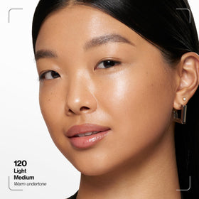 Revlon dropper dispensing skin tint showing lightweight, blendable texture
