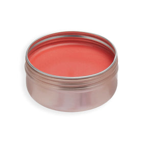 Revolution Balm Glow close-up on cheeks showing natural peach flush and dewy glow