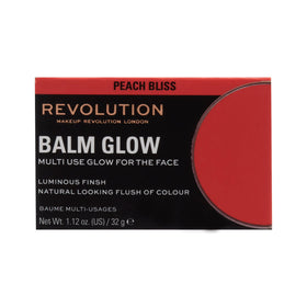 Revolution Balm Glow next to coin showing product size and travel-friendly convenience