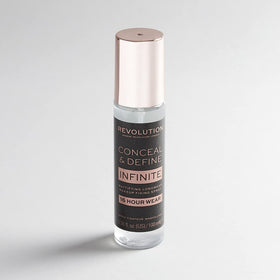 Revolution Beauty London Infinite Fixing Spray in use on model showing quick application and prolonged makeup hold