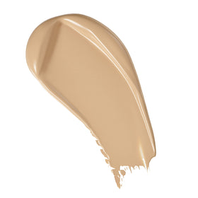 Revolution Beauty London model applying F6 foundation to cheek for even, longwear matte finish