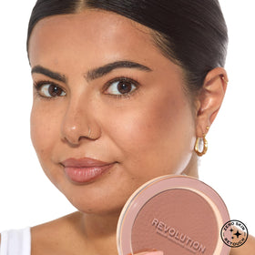 Revolution mega bronzer four shades swatched on arm showing shade range for varied skin tones