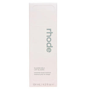Rhode applying essence to hand to show absorption and prepping benefit