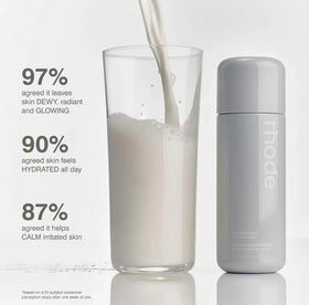 Rhode applying essence to cheek demonstrating dewy glazed finish and layering