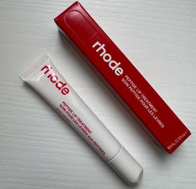 Rhode front packaging of strawberry glaze peptide lip treatment showing compact tube and label for quick use
