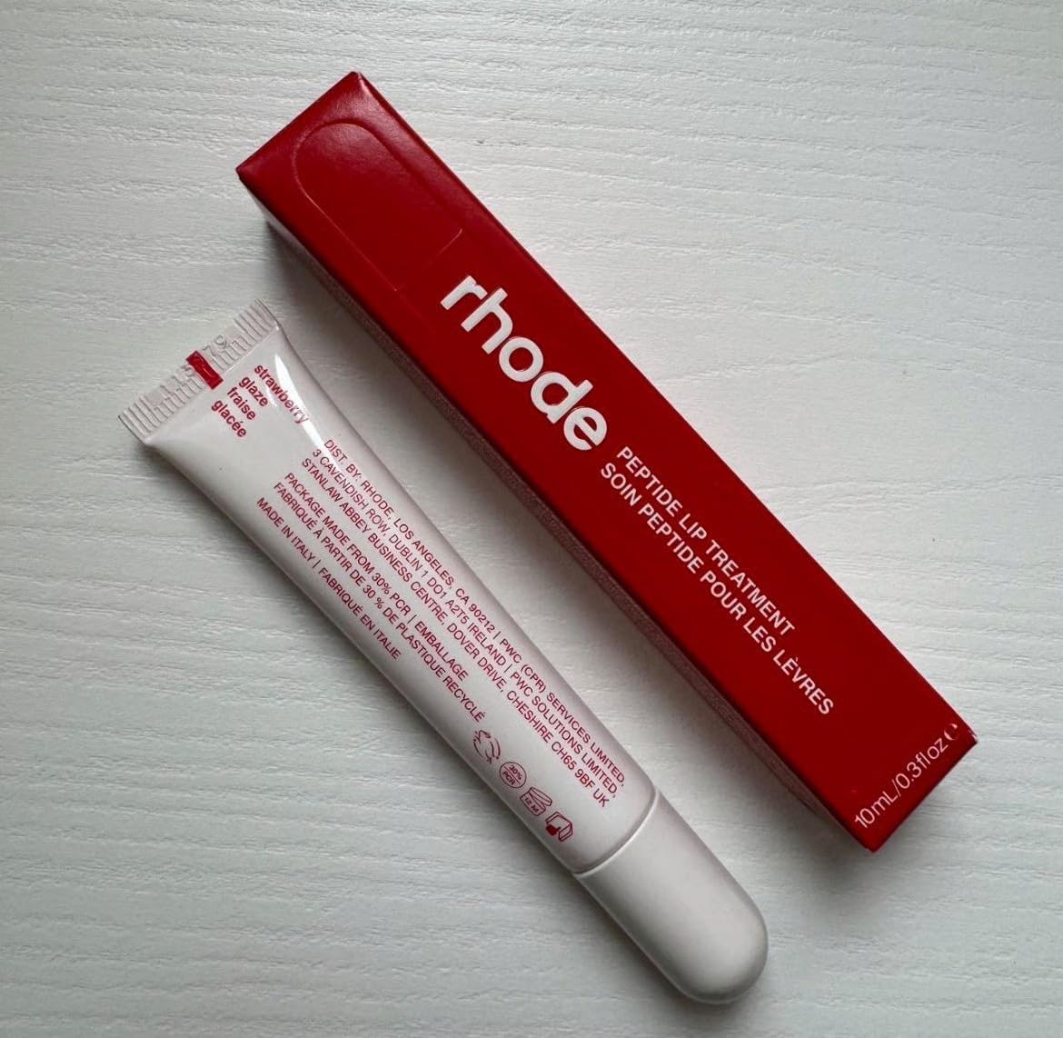 Rhode close-up of strawberry glaze lip balm texture demonstrating glossy finish and visible hydration
