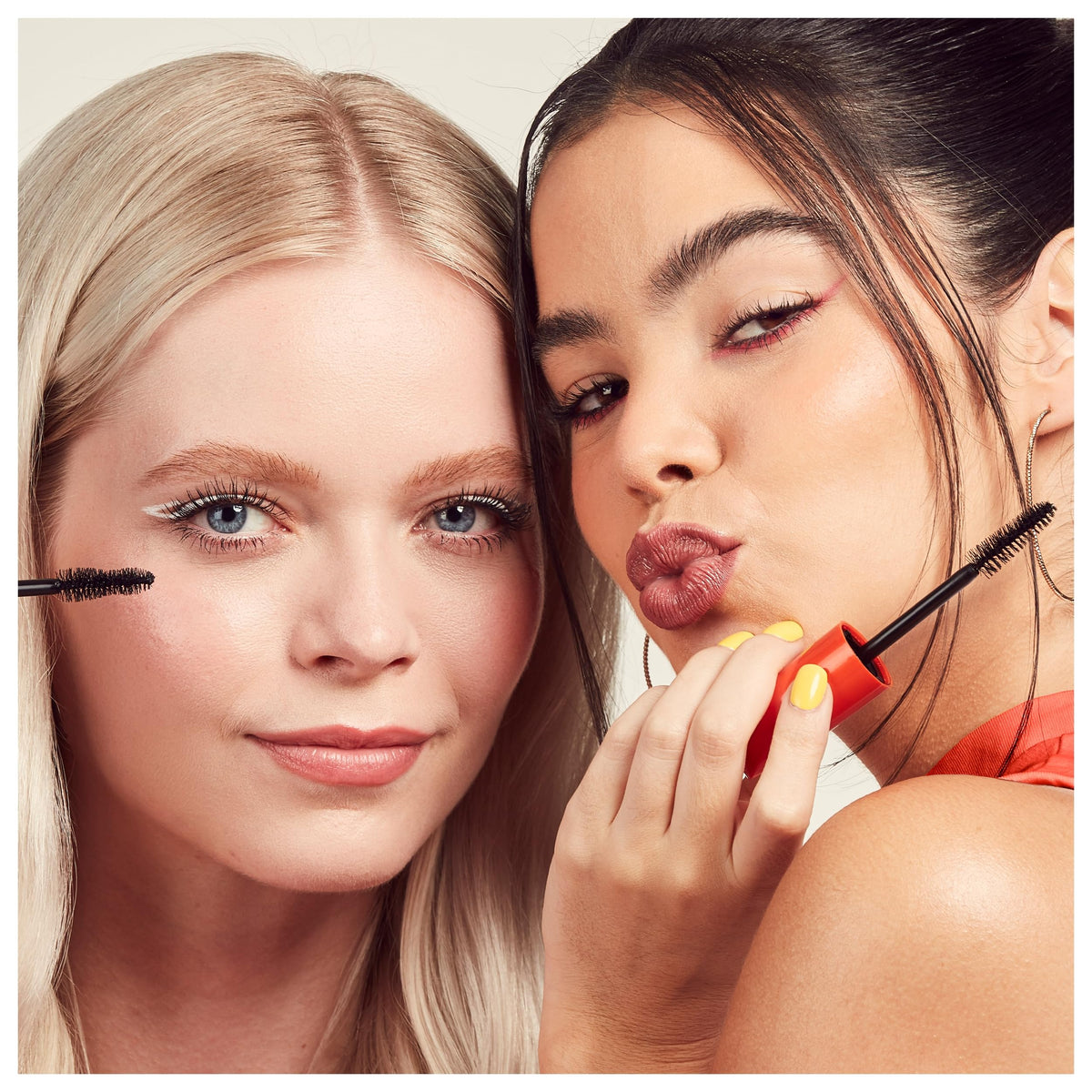 Hand holding Rimmel combo to show size and convenient travel-ready pack
