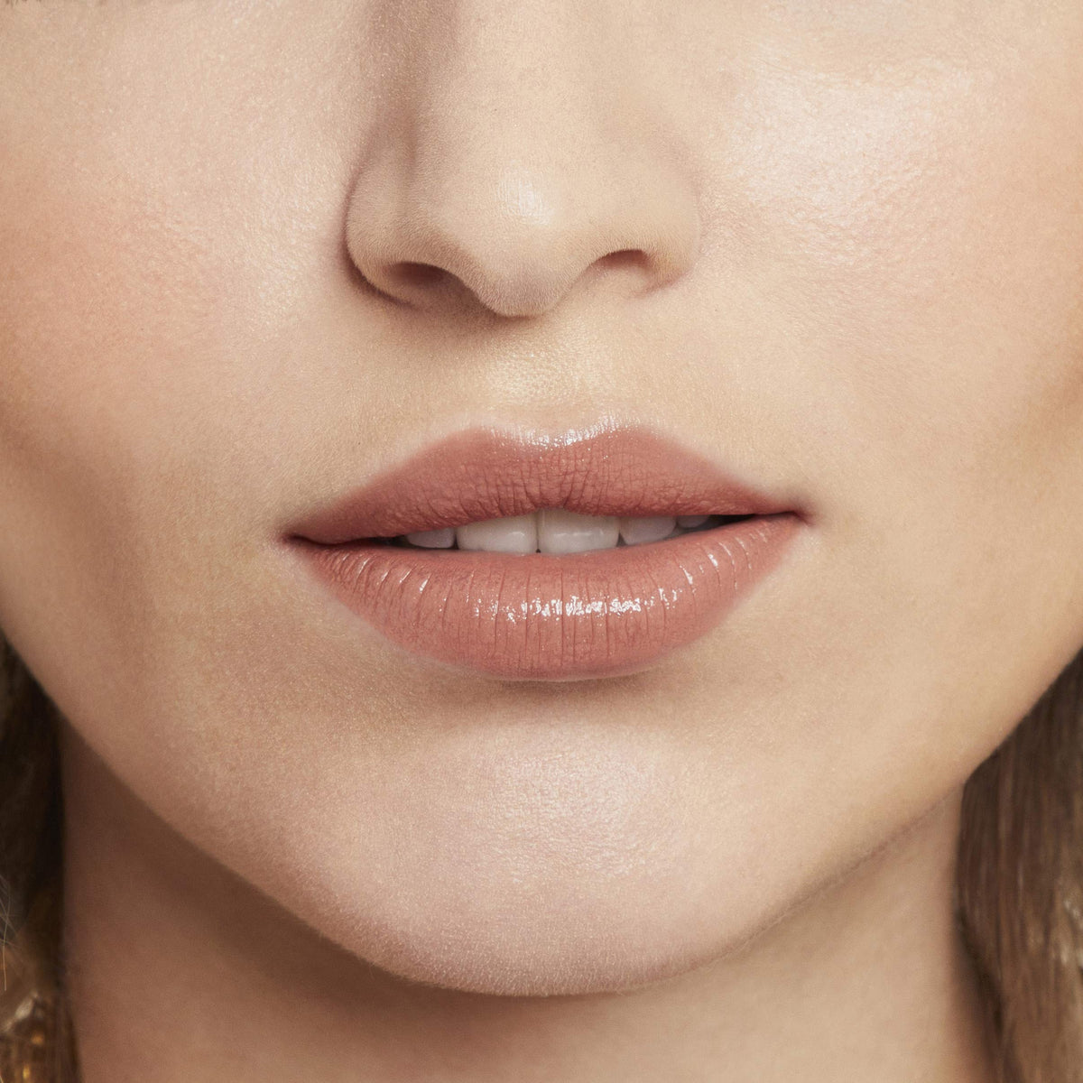 Rimmel Provocalips on model during daytime wearing long‑lasting glossy color