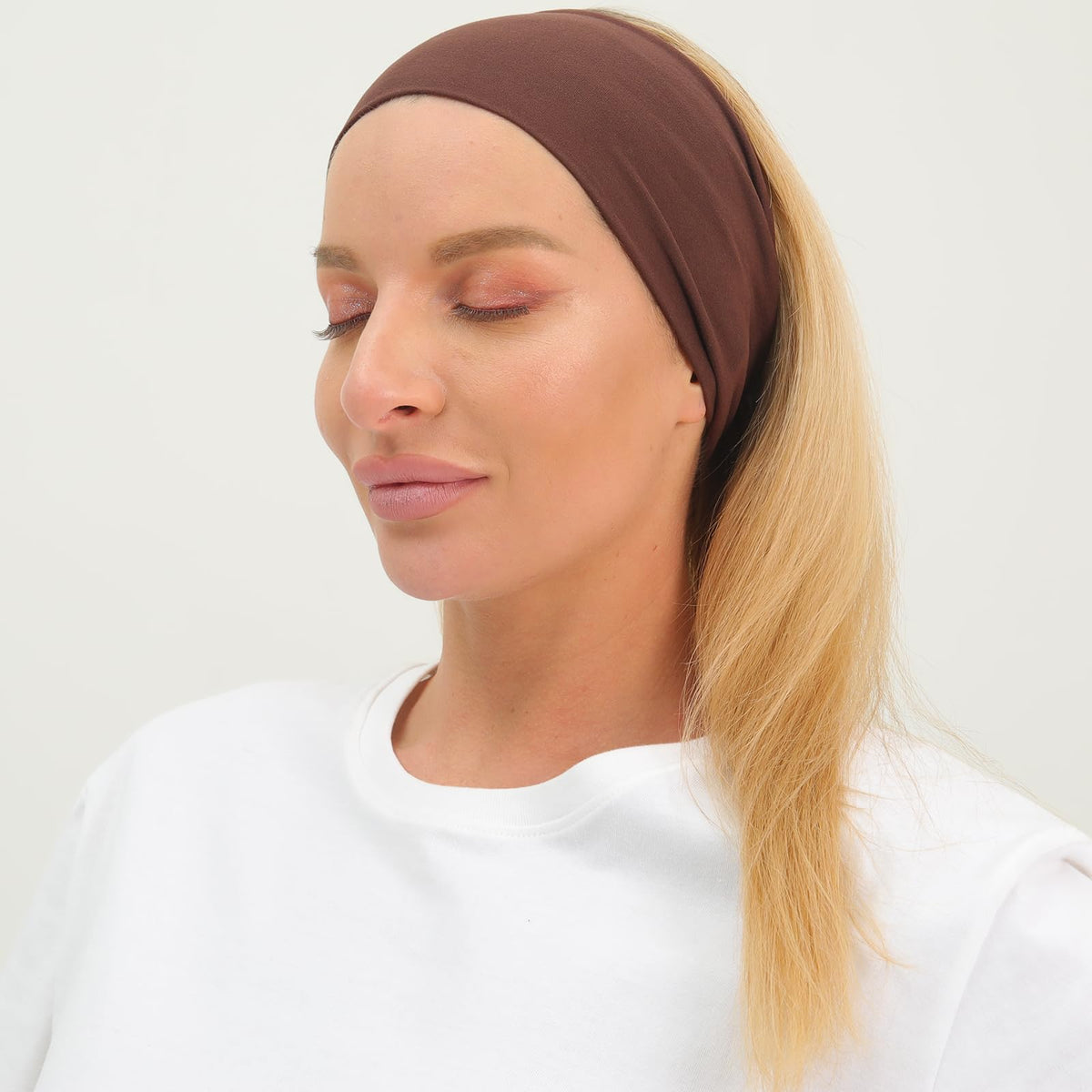 RITOPER headband styled on a traveler at the beach showing lightweight comfort and easy packability