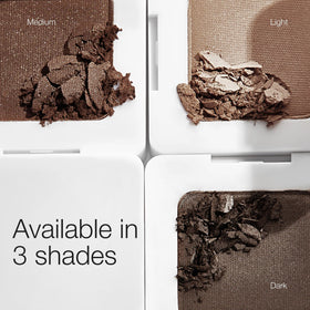 RMS Beauty compact held in hand showing portable size and travel convenience