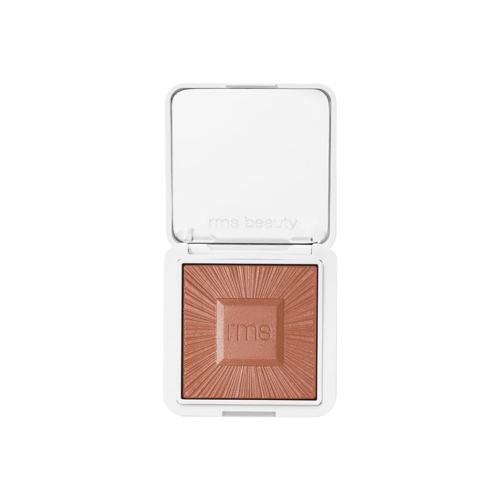 RMS Beauty compact front view showing sleek refillable case and mirror benefit