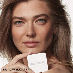 RMS Beauty hydra bronzer inside a makeup bag illustrating travel-friendly design