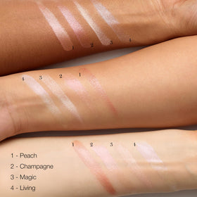 RMS Beauty luminizer tapped on cheekbone for a dewy, lifted look