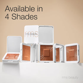 RMS Beauty compact in hand for scale demonstrating convenient travel-friendly size