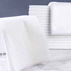 rngwaper stacked towels in spa setting offering sanitary guest use