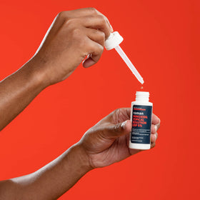 Ro Roman liquid texture on scalp demonstrating easy absorption benefit