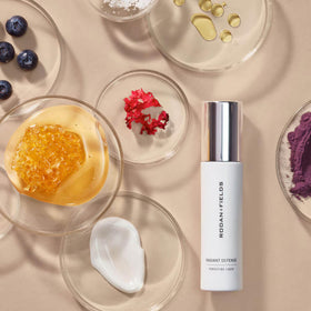 RODAN + FIELDS applying product on cheek for even-tone benefit