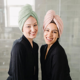 ROLSHOL towel held in hand showing extra-large size and full coverage benefit