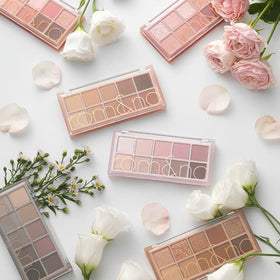 rom&nd palette lid close-up displaying shimmer and glitter texture for luminous impact