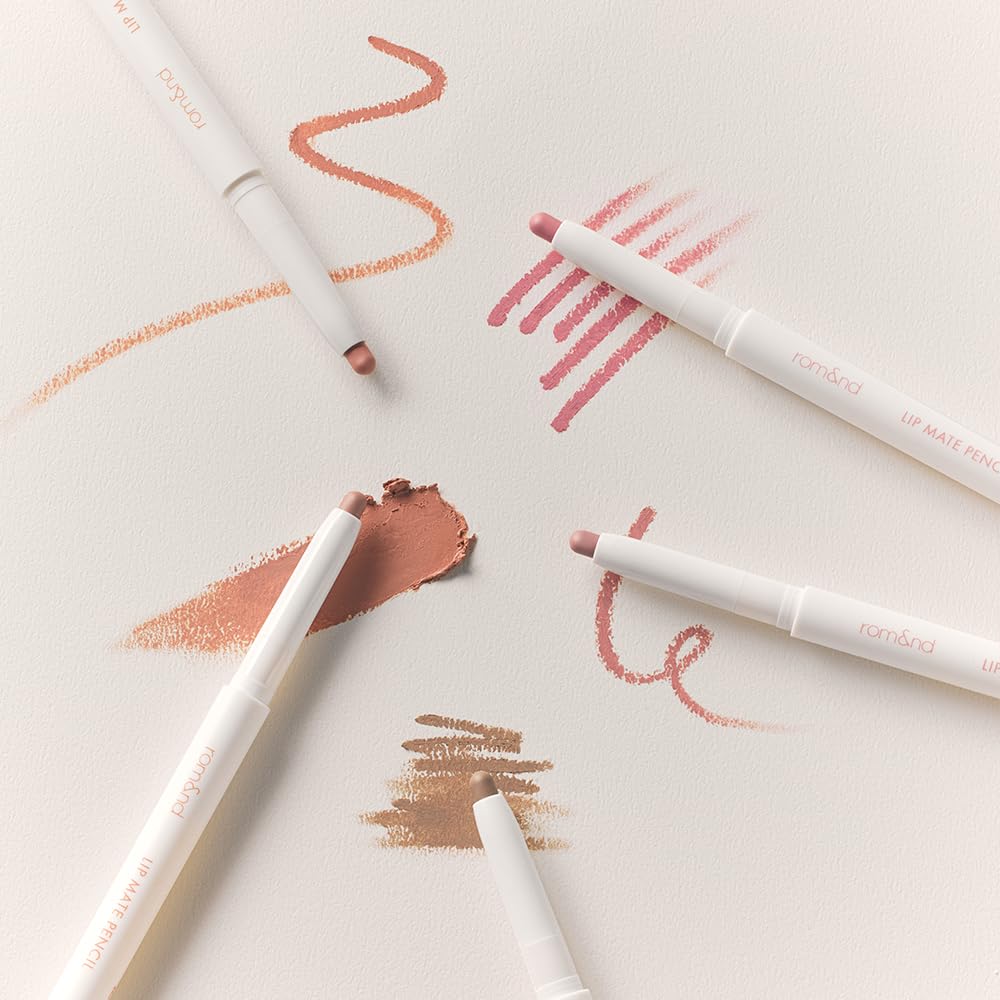 rom&nd Lip Mate Pencil held in hand to show portable size and travel ease