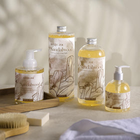 ROMIIE ZOI placed beside sink in bathroom showcasing calming sandalwood ambiance benefit
